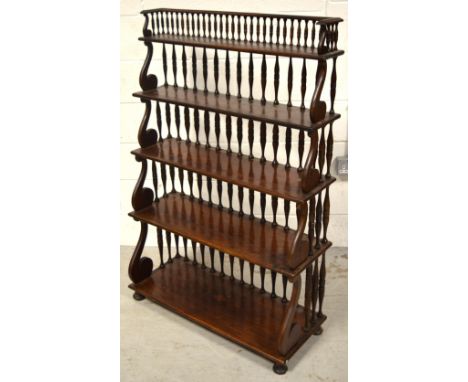 A Continental waterfall open bookcase with bobbin turned and moulded music note supports, width 84cm. CONDITION REPORT Would 