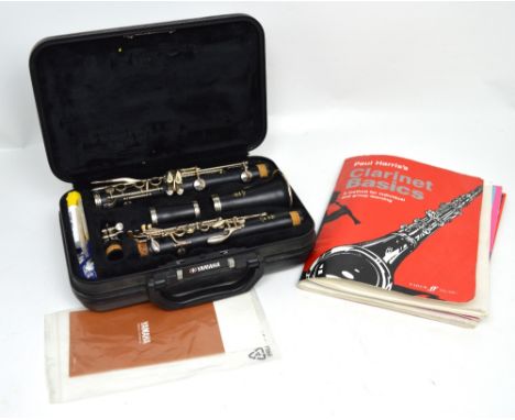 A cased Yamaha 250 clarinet with a quantity of music books to include Paul Harris 'Clarinet Basics', 'Progressive Studies for