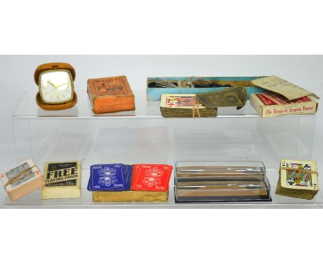 A collectors' lot comprising vintage alarm clocks, playing cards, Parker pens etc.