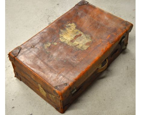 A vintage brown leather suitcase.