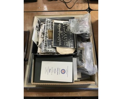 A print and a tray of ephemera