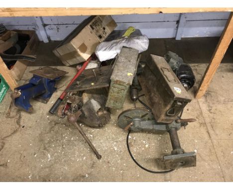 Various tools to include a vice and a jack etc.