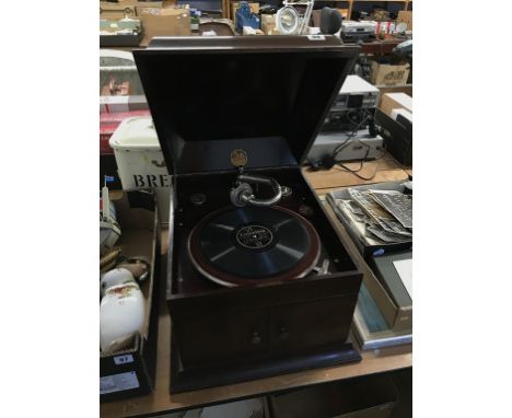 A gramophone and an enamel bread bin