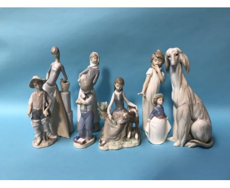 A collection of Lladro and Nao figures (8)