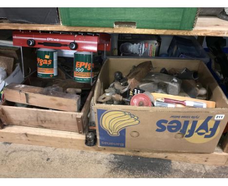 A quantity of tools on one shelf