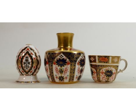 Three Royal Crown Derby pieces: Old Imari 1128 gilt vase 11cm high x 9cm wide, India pattern decorative egg on ceramic stand 