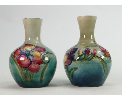 Pair of Walter Moorcroft Freesia vases on green blue ground: Height 12cm. (2) 