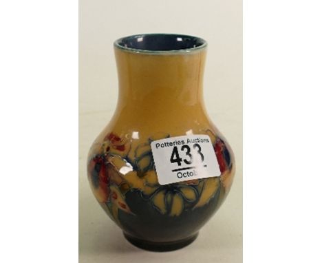 Walter Moorcroft small vase decorated with Orchids: with unusual Ochre/blue ground, h.12.75cm. (several under glaze base edge