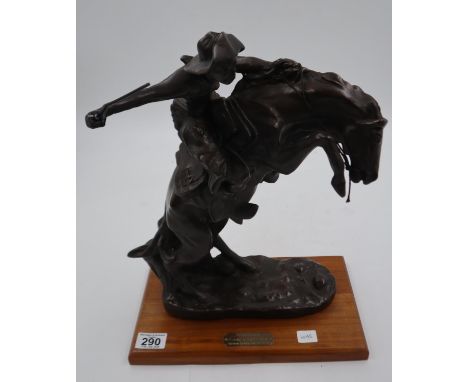 Frederick Remington bronzed sculpture, The Bronco Buster, hand/whip repaired, H: 41 cm. Not available for in-house P&amp;P 