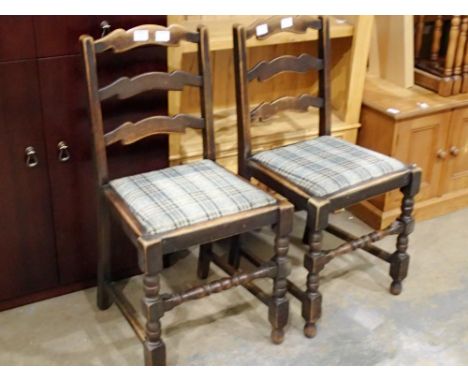 A pair of oak framed ladder backed chairs. Not available for in-house P&amp;P