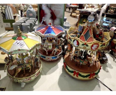 Three Christmas carousels. All electrical items in this lot have been PAT tested for safety and have passed. This does not co