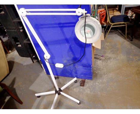 Articulated LED magnifying floor standing lamp. All electrical items in this lot have been PAT tested for safety and have pas