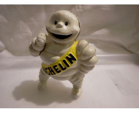 Cast iron Michelin man, H: 18 cm. UK P&amp;P Group 1 (£16+VAT for the first lot and £2+VAT for subsequent lots) 