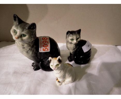 Two Beswick cats and a Royal Worcester example. Not available for in-house P&amp;P 