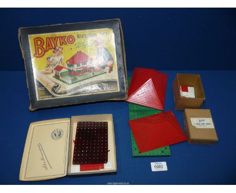 A vintage Bayko building set and scene, with extra pieces.