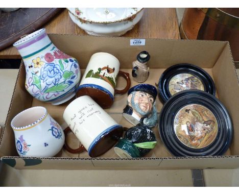 A quantity of china including Poole vases, Torquay ware tankards, Royal Doulton character jugs (including Winston Churchill) 