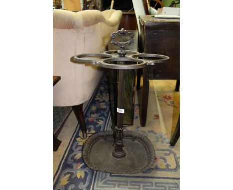 A cast iron four section Stick/Umbrella Stand, 28'' tall.