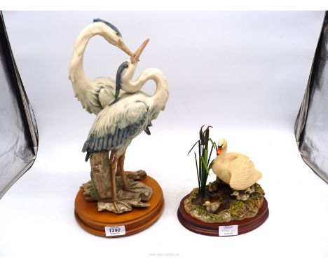 A Guiseppe Armani figure of two Herons, one heron's crown a/f., 17" high and a Border Fine Arts Swan and signets figure 'Firs