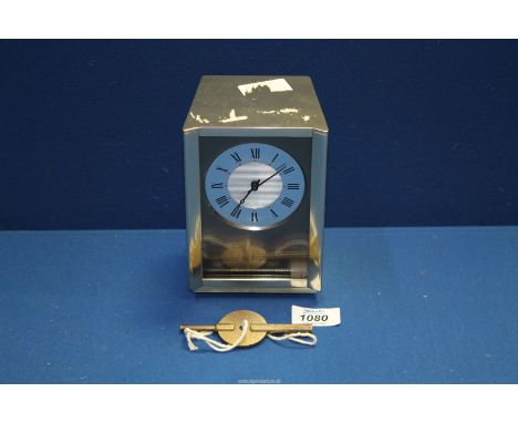A 1970's eight Day Mantle Clock by Elliot of London, 4" x 6" in working order with key.