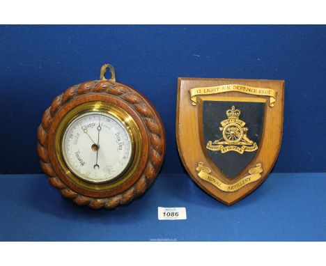 A Royal Artillery 12 Light Air Defence Regimental Shield mounted on wood and a 19th century circular aneroid Barometer with w