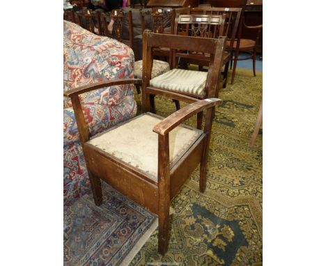 A Satinwood framed open armed Commode Chair (not furnished).