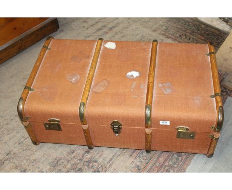 A canvas and bentwood bound Trunk with brass corners and fixings, leather side carrying handles and internal tray, 33" x 20 1