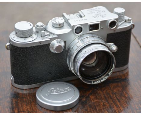 Ernst Leitz Wetzlar - A 1941 Leica IIIc 35mm Range Finder Camera, with red curtain, appears to be in good working condition w