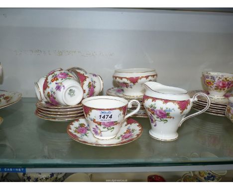 An Aynsley part Teaset to include five cups and six saucers, seven tea plates, bread and butter plate and a sugar bowl and cr