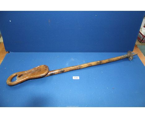 An old wooden shooting stick.