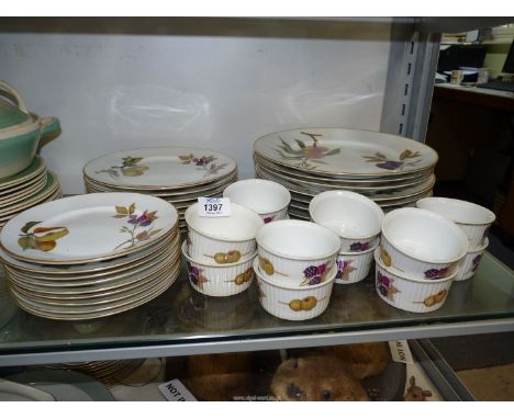 A quantity of Royal Worcester 'Evesham' dinnerware to include eight dinner and side plates, nine tea plates and twelve rameki