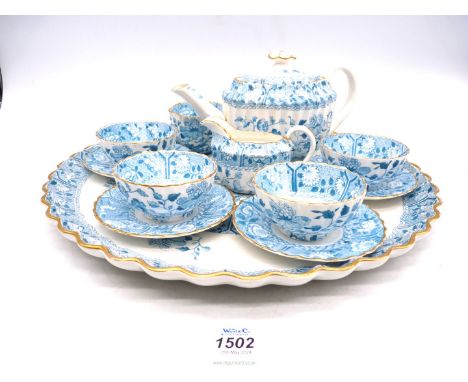 An old Spode tea service for four with tray, in turquoise floral decoration to cup interiors and butterfly and floral pattern