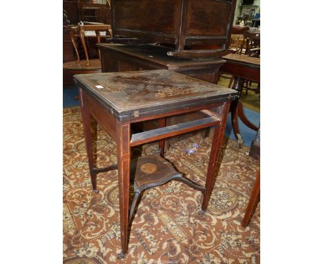 A Rosewood and other woods Envelope Card Table, the top with contrasting inlaid stringing and scroll decoration, opening to r