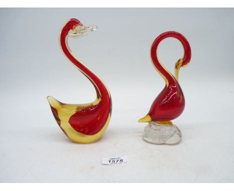 A Murano glass swan with base label "Vetro Artistico Veneziano" in red and cased with lemon standing on swirled clear crystal