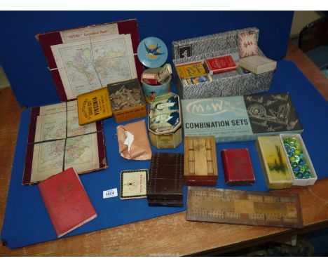 A quantity of old games and wooden jigsaws, playing cards, etc.