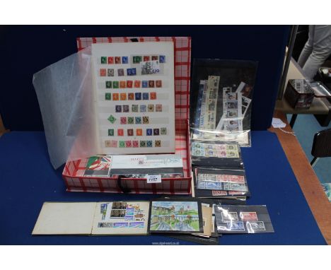 A quantity of boards of mint and franked stamps GB stamps, First Day Covers and a small album with contents.