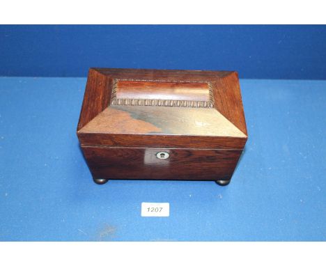 A Mahogany Sarcophagus shaped tea caddy, two lids present and standing on button feet. 8 1/2" wide x 5 1/8" depth x 5 1/2" hi