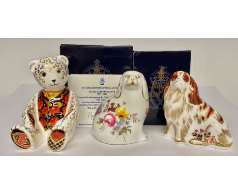 A Royal Crown Derby paperweight, Cavalier King Charles Spaniel, gold stopper, 10cm, printed mark in red, boxed; others, Debon