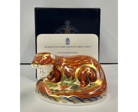 A Royal Crown Derby paperweight, Otter, a gold signature edition, specially commissioned by The Guild of China &amp; Glass Re