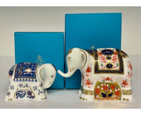 A Royal Crown Derby paperweight, Imari Elephant Infant, decorated in the 1128 pattern, gold stopper, 8cm high, printed mark i
