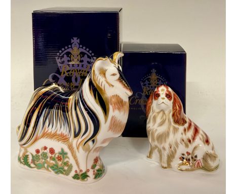 A Royal Crown Derby paperweight, Cavalier King Charles Spaniel, gold stopper, 10cm, printed mark in red, boxed; another, Roug