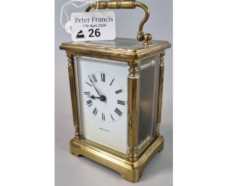 Brass carriage clock with Roman numeral face, marked 'Packer'. With key. (B.P. 21% + VAT)  Works but not tested long term. wi