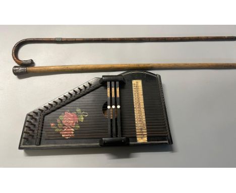 Early 20th century German Zither with floral decoration together with a malacca cane walking stick with metal mount, another 