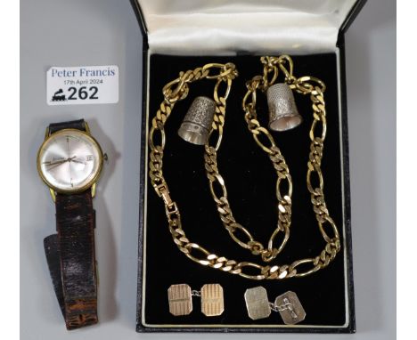 Accurist gentleman's gold plated wristwatch on leather strap, two silver thimbles, two gold plated on silver pairs of engine 