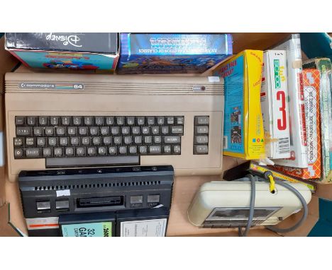Commodore 64 with  datassette, Atari 2600 console and various games including: The Hobbit (no case), Run the Gauntlet, Sega g