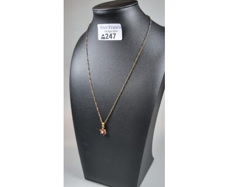 9ct gold fine link chain with diamond and ruby flowerhead pendant.  4.2g approx.  (B.P. 21% + VAT) 