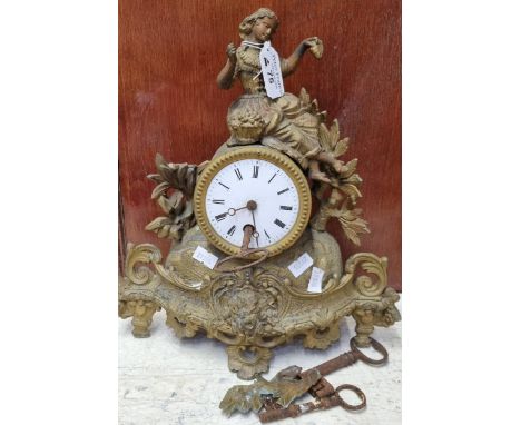 Late 19th century French gilt metal single train mantel clock with figural mount and enamel Roman numeral face.  With Keys.  