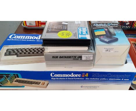 Commodore 64 Micro Computer in original box together with a user manual, Commodore Model CN2 Datassette Unit, Quickshot Delux