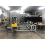 2021 Tecnaflu UV painting and curing line with 274 rotating sprockets bottle holders, runs at 25 fee
