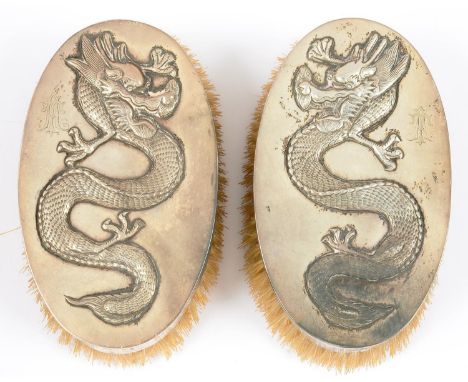 TWO SILVER BRUSHES, CHASED WITH CHINESE DRAGONS, 13 CM W, MAKER'S MARK PC, EARLY 20TH C 