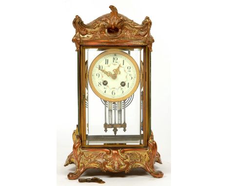 AN ORNATE FRENCH CAST GILTMETAL FOUR GLASS CLOCK, WITH PRIMROSE ENAMEL DIAL, GONG STRIKING MOVEMENT, 36CM H, LATE 19TH C 